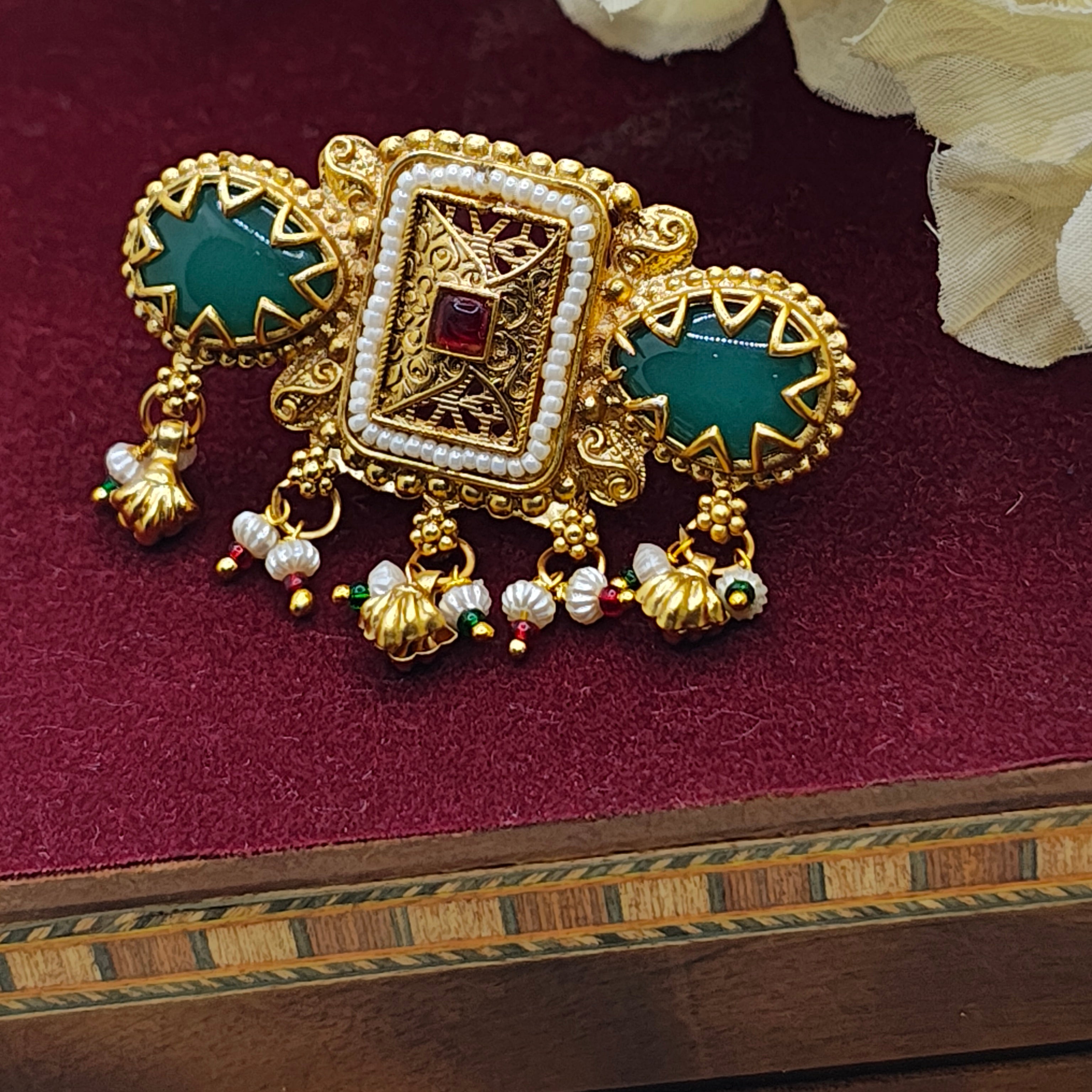 Rajasi Antique Gold Kundan Ring with green stone and pearl drops, showcasing intricate traditional Indian design.