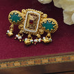 Rajasi Antique Gold Kundan Ring with green stone and pearl drops, showcasing intricate traditional Indian design.